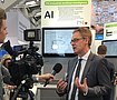 Interview with AI expert Dr. Felix at the Hannover Fair. Photo: PSI
